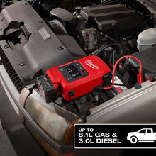 Load image into Gallery viewer, Red Milwaukee battery pack on a car engine with text indicating capacity. | Auto Obsessed